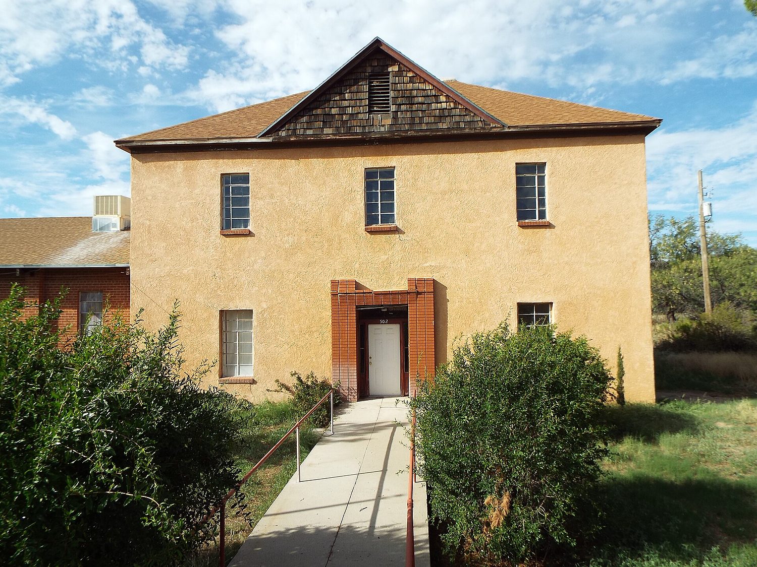 The Mountain View building today in Oracle, Arizona, its porches and adobe hidden beneath plain stucco.